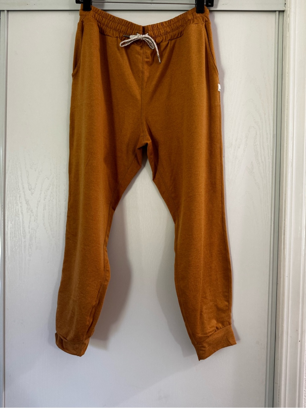 Vuori Women's Performance Joggers in a warm mustard yellow color